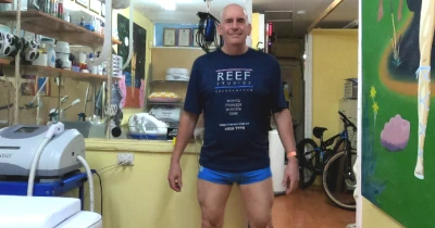 Andrew Thompson, manzilian waxing therapist in lycra shorts and t-shirt